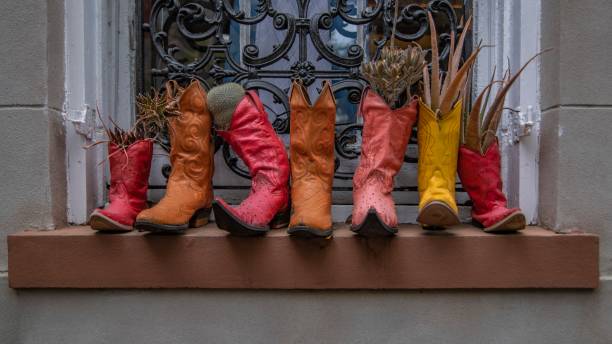 istock Cowboy boot planter on the outside windowsill 1443171192