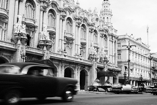 La Habana, Cuba – September 01, 2018: A greyscale shot of  vintage classic car in the road of Havana, Cuba