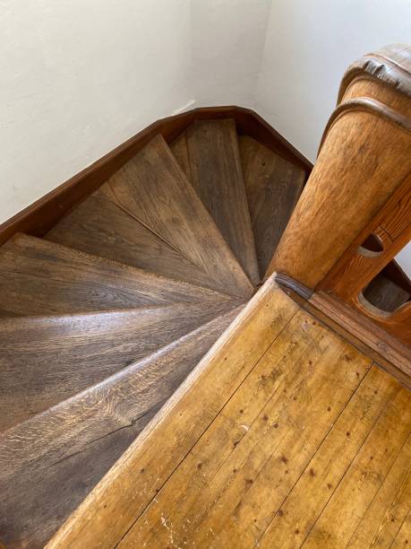 istock Wooden spiral staircase, vertical shot 1443173820