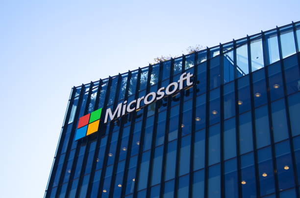 Big letters on the grass - Microsoft. Logo of a computer corporation at the entrance to the building Israel Herzliya November 2022. Microsoft building. Modern hub made of glass and metal. Close-up company logo - capital letters . Entrance to the building. microsoft stock pictures, royalty-free photos & images