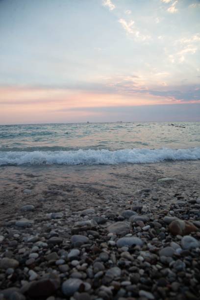 istock Vertical shot of a rocky beach in the sunset 1443174537