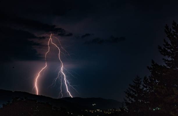 istock Spectacular view of a thunderstorm lightning in the night sky 1443174882