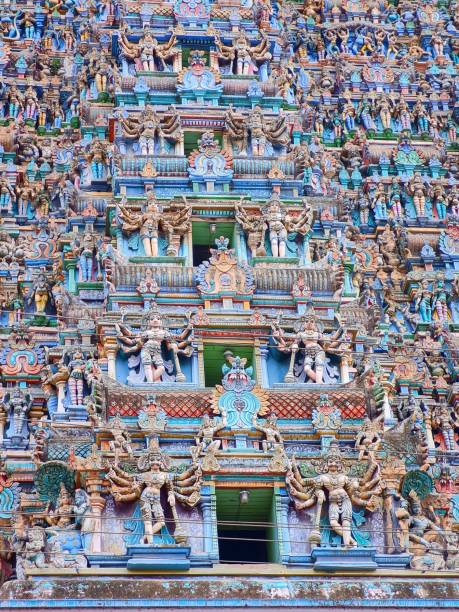 Facade of Meenakshi Amman Temple temple covered in colorful statues in Madurai, Tamil Nadu, India The facade of the Meenakshi Amman Temple temple covered in colorful statues in Madurai, Tamil Nadu, India menakshi stock pictures, royalty-free photos & images