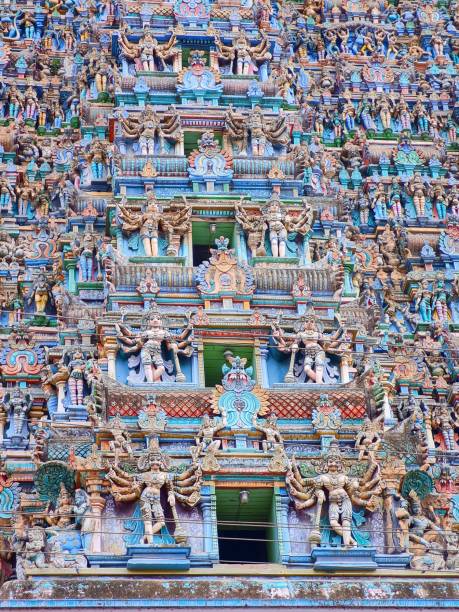 facade of meenakshi amman temple temple covered in colorful statues in madurai, tamil nadu, india - madurai kerala india tamil nadu imagens e fotografias de stock