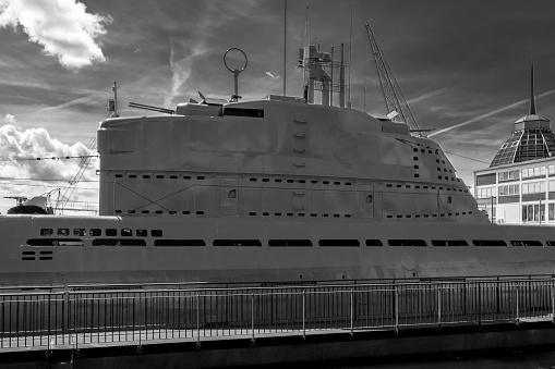 A grayscale shot of a big ship in the dock