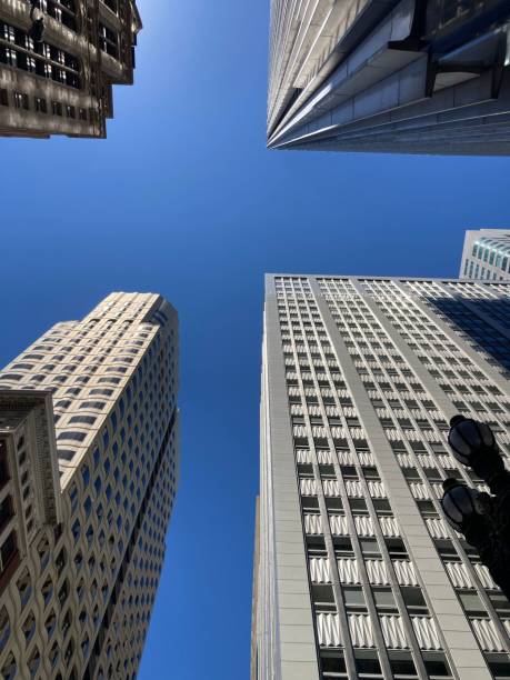 istock Low angle shot of modern skyscrapers under clear blue sky 1443178470
