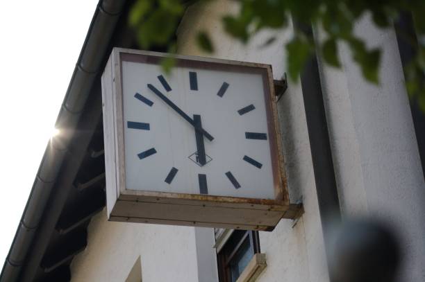 istock Close-up shot of a rusty clock on a building wall 1443179428