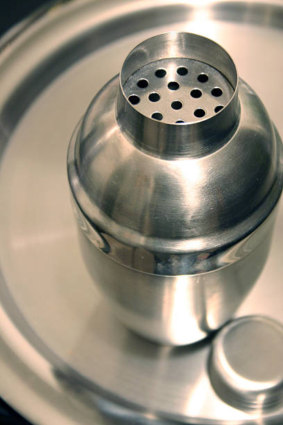 Chrome Martini shaker on a serving tray stock photo