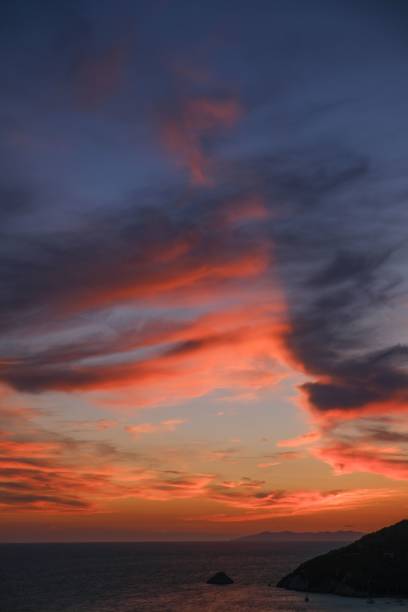 istock Beautiful view of clouds in the sky during an orange sunset 1443181792