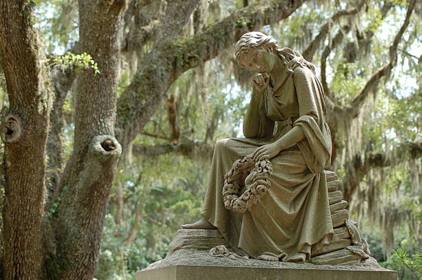 Statue of a waiting woman in Bonaventure Cemetery stock photo