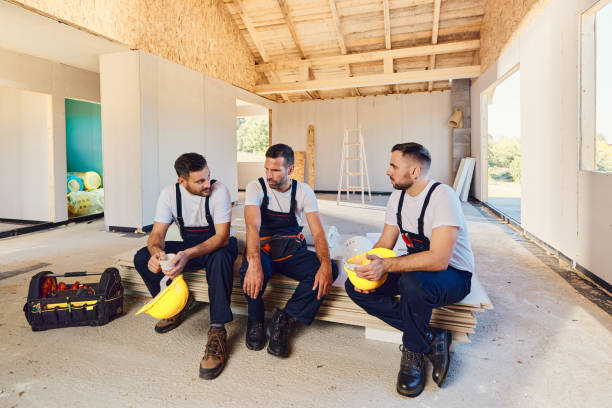 istock Group of manual workers talking on a break at construction site. 1443182189