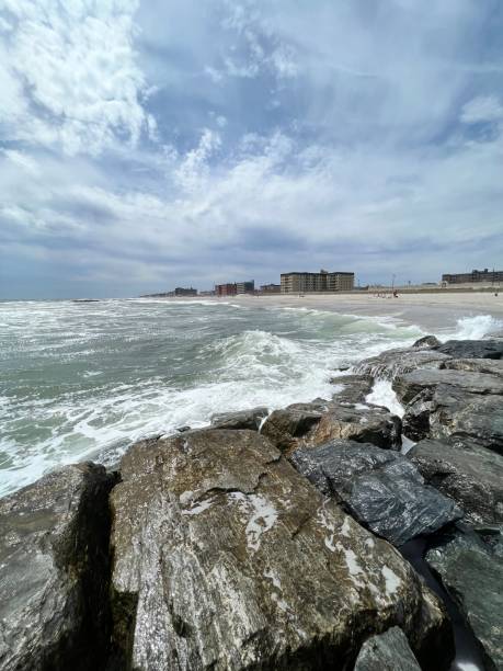 istock Vertical of ocean waves from a side view at Long Beach, New York 1443183294
