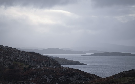 Subtle silvery light on the sea, on a dull cloudy overcast day looking from above Clachtoll toward Achmelvich.