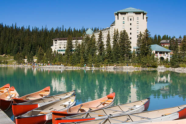 Canoes across from the Chataeu Lake Louise stock photo