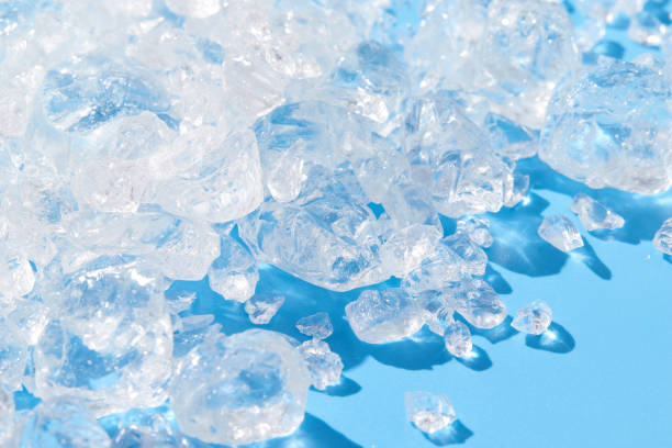 istock Close up crushed ice in sunlight on blue. Summer background refreshment concept 1443185919