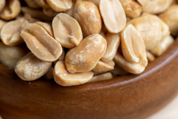 istock Peeled and roasted peanuts on the table 1443187562