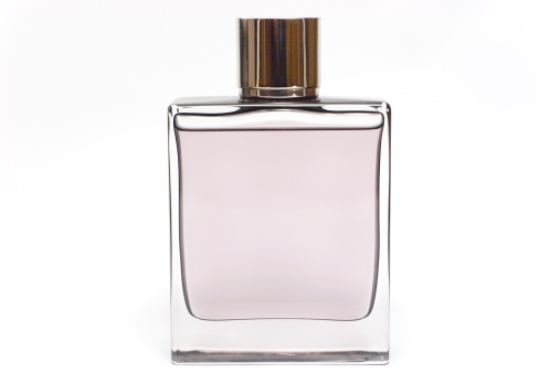 Transparent perfume bottle isolated on white