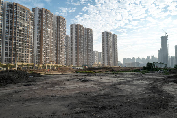 Construction empty dirt site in the morning An empty construction site in front of an urban community in Putian, Fujian Province empty lot construction stock pictures, royalty-free photos & images