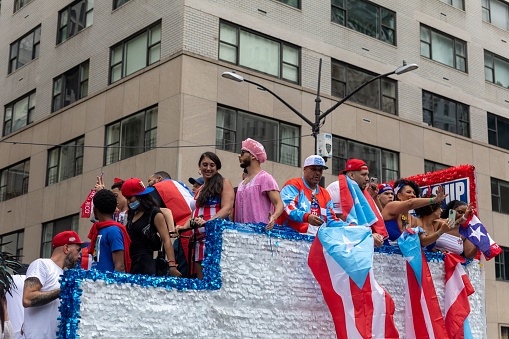 – June 13, 2022: The large crowds of people in the streets of Manhattan celebrating the Puerto Rican Day Parade