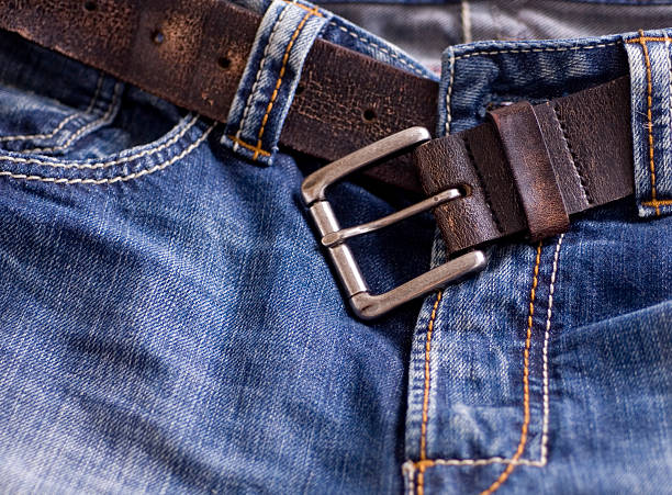 istock Fashionable faded denim jeans and leather belt 144319084