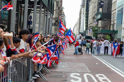 – June 13, 2022: The large crowd celebrating Puerto Rican Day Parade 2022 on the streets of New York City, USA
