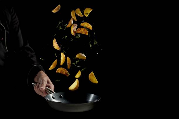 istock Crop cook preparing potato wedges in frying pan 1443191108
