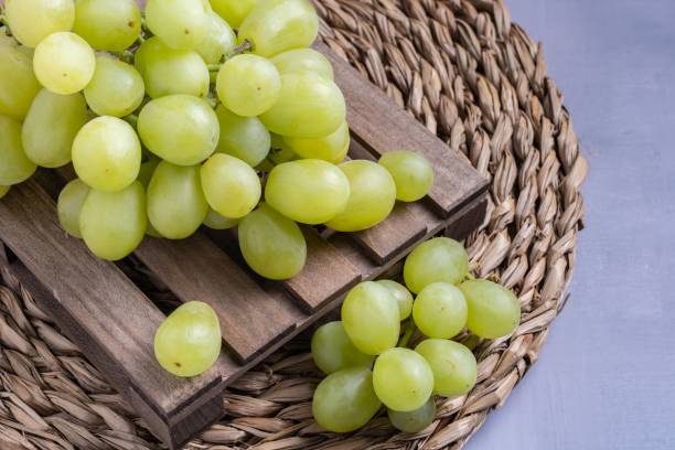 istock Closeup shot of white grapes on the table 1443191564