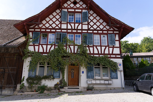 Historic frame house at rural village of Kyburg, Canton Zürich, on a cloudy late summer day. Photo taken September 1st, 2022, Kyburg, Switzerland.