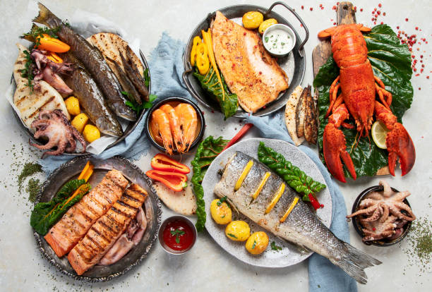 istock Various of seafood platter - prawn shrimp, squid, octopus mini, salmon, lobster. 1443192176