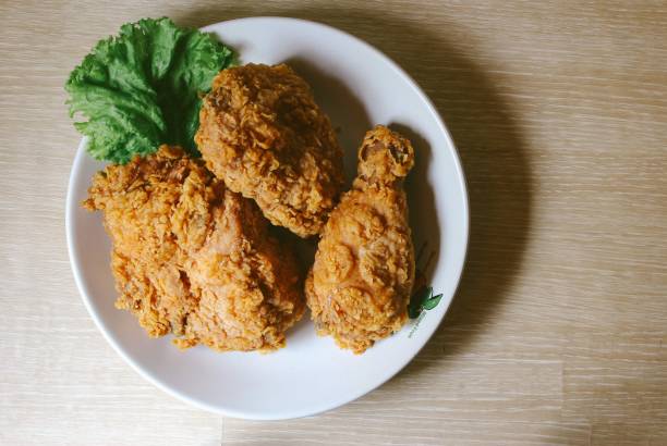 istock Top view of crispy fried chicken on a wooden table 1443192409