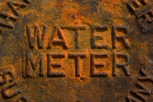 Rusted water meter cover.