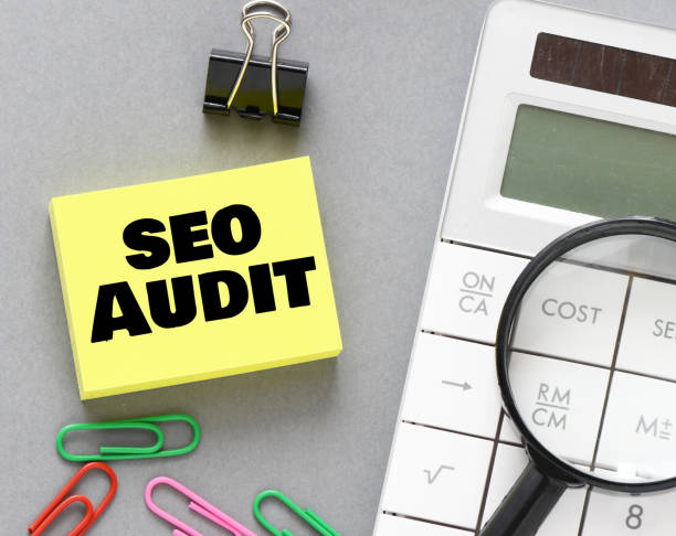 istock SEO AUDIT words on a small piece of paper. 1443193504