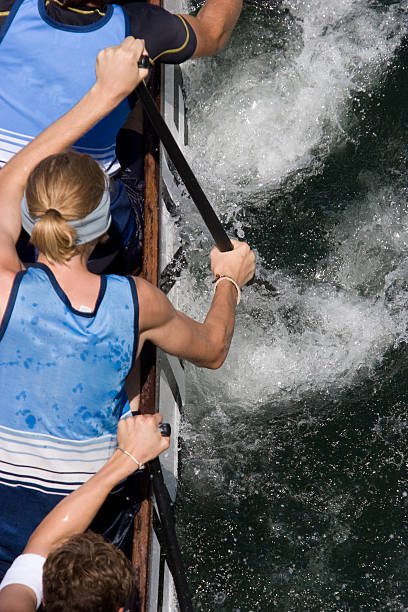 An aerial shot of a dragon boat rowers stock photo