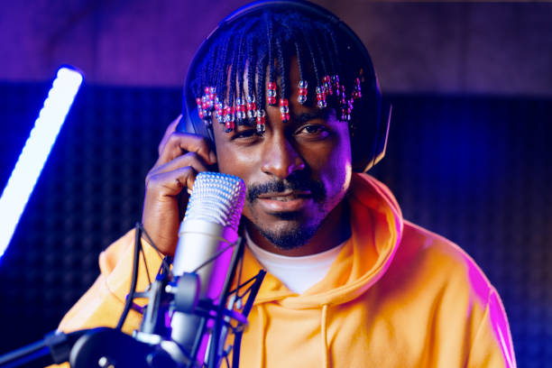 istock Young African performer recording his new track in recording studio 1443196281
