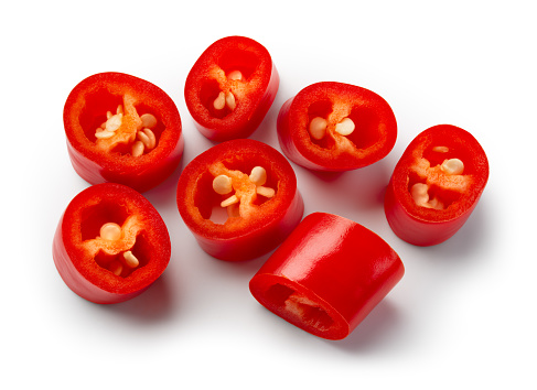 Chili pepper isolated. Cut chilli top view on white background. Red hot chili peppers slice top. With clipping path.