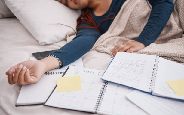 Calendar, time management and student sleeping in bed for studying education, learning knowledge and planning. Tired, burnout college university woman with notebook, sticky note planner and schedule Calendar, time management and student sleeping in bed for studying education, learning knowledge and planning. Tired, burnout college university woman with notebook, sticky note planner and schedule time management student stock pictures, royalty-free photos & images