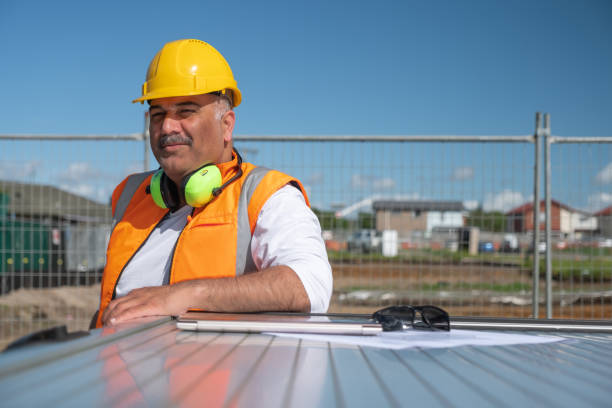 istock Engineer Leaning on the back of a Vehicle 1443197802