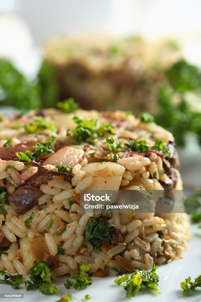 Risotto with liver Tasty risotto with liver and parsley on the plate Arranging Stock Photo