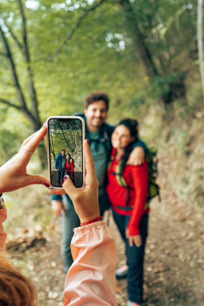 istock taking a pic to the friends 1443200721