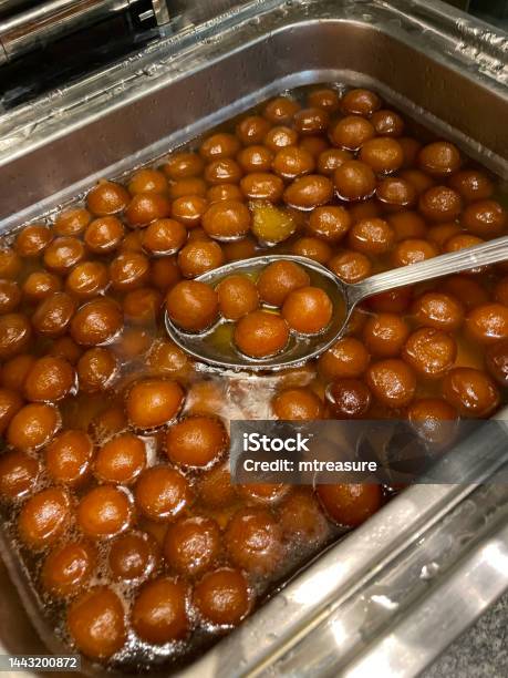 Image Of Catering Tray Of Gulab Jamun Elevated View Focus On Foreground Stock Photo - Download Image Now