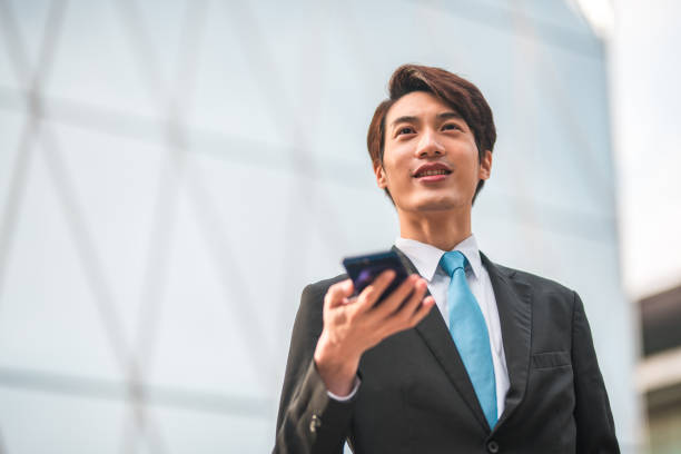 istock Good Looking Businessman with a Cellphone on his Hand 1443203285