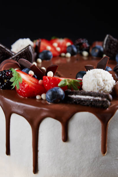 istock Cake decorated with strawberry and chocolate on dark background 1443205560