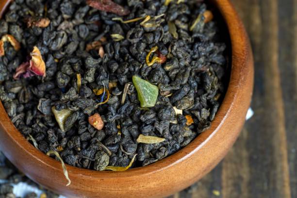 istock Dried large-leaf green tea with pieces of fruit 1443205751