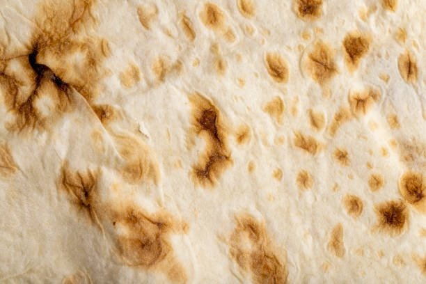 istock Wheat pita bread with dark spots 1443205778