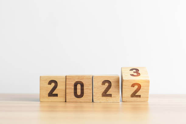 istock 2022 change to 2023 year block on table background. goal, Resolution, strategy, plan, start, budget, mission, action, motivation and New Year concepts 1443206064