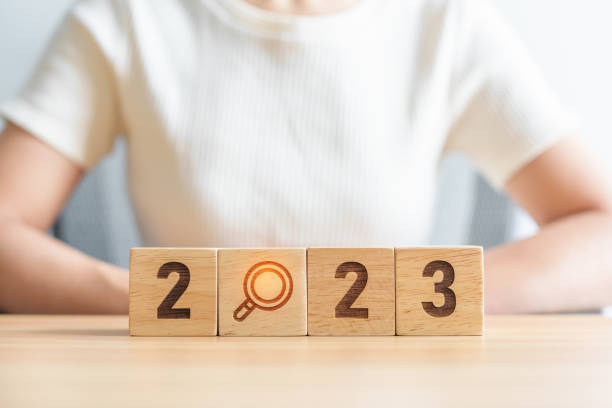 istock 2023 block with magnifying glass icon. SEO, Search Engine Optimization, hiring , Advertising, Idea, Strategy, marketing, Keyword, Content and New Year start concepts 1443206181