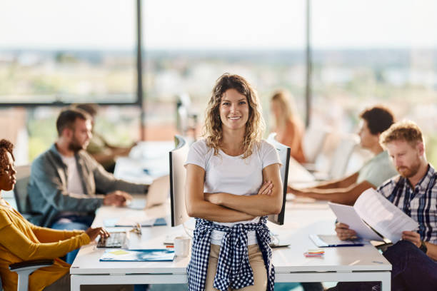 istock Happy CEO with crossed arms in a computer software company. 1443206983