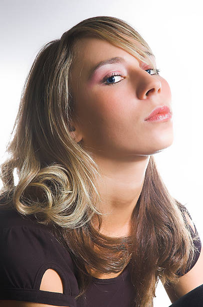 Portrait of the beautiful girl on a white background stock photo