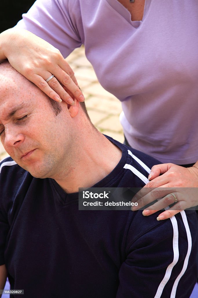 Stretch to left side of the neck traditional Thai Massage Stretch to the letf side of the neck as part of a traditonal Thai body massage (350dpi) Alternative Therapy Stock Photo