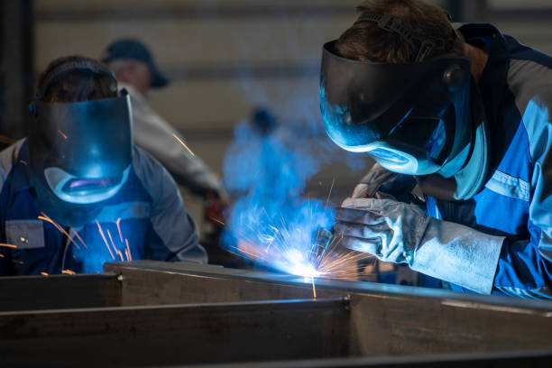 istock Welders working in factory 1443208316